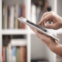 Woman holding digital tablet in library